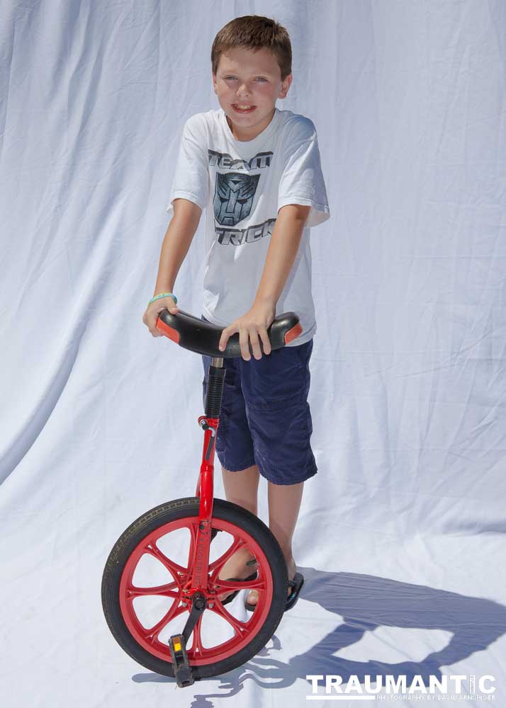 The third year shooting these images.  There were a ton of fun images of the kids this year and the graphic artist made some rather unexciting image choices.  The images of Nathan Klima illustrate this clearly.  I made the Star Wars image of him from one of his excellent jumping poses.  Compared to his mile marker, huge difference.