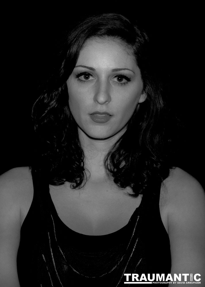 Sometimes you get a chance to shoot with an amazing nude model, and what do you do?  Shoot pictures of her sitting on a chair fully clothed.  She's gorgeous, and I love these shots.