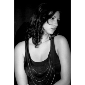 Sometimes you get a chance to shoot with an amazing nude model, and what do you do?  Shoot pictures of her sitting on a chair fully clothed.  She's gorgeous, and I love these shots.