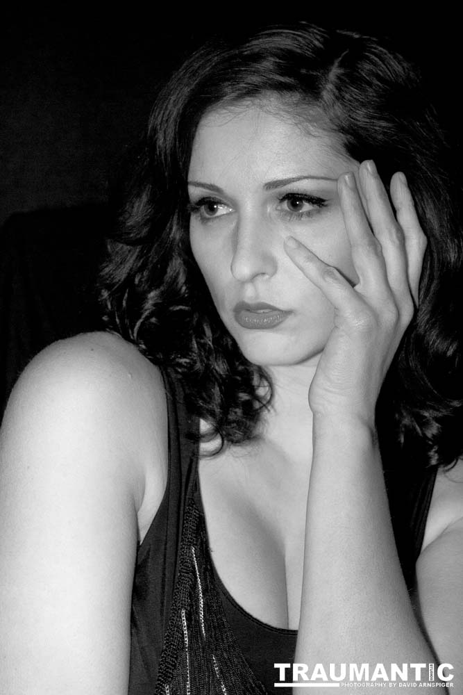 Sometimes you get a chance to shoot with an amazing nude model, and what do you do?  Shoot pictures of her sitting on a chair fully clothed.  She's gorgeous, and I love these shots.