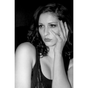 Sometimes you get a chance to shoot with an amazing nude model, and what do you do?  Shoot pictures of her sitting on a chair fully clothed.  She's gorgeous, and I love these shots.