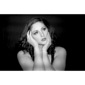 Sometimes you get a chance to shoot with an amazing nude model, and what do you do?  Shoot pictures of her sitting on a chair fully clothed.  She's gorgeous, and I love these shots.