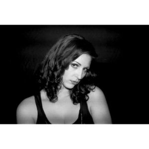 Sometimes you get a chance to shoot with an amazing nude model, and what do you do?  Shoot pictures of her sitting on a chair fully clothed.  She's gorgeous, and I love these shots.