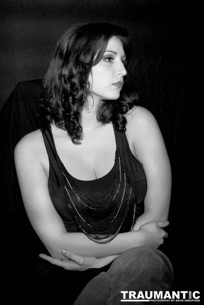 Sometimes you get a chance to shoot with an amazing nude model, and what do you do?  Shoot pictures of her sitting on a chair fully clothed.  She's gorgeous, and I love these shots.