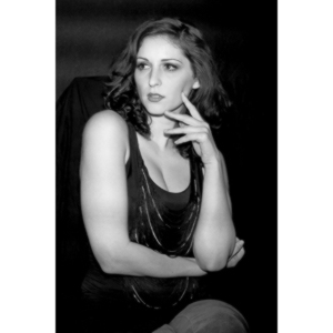 Sometimes you get a chance to shoot with an amazing nude model, and what do you do?  Shoot pictures of her sitting on a chair fully clothed.  She's gorgeous, and I love these shots.