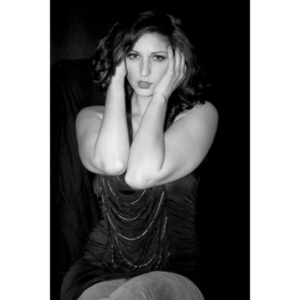 Sometimes you get a chance to shoot with an amazing nude model, and what do you do?  Shoot pictures of her sitting on a chair fully clothed.  She's gorgeous, and I love these shots.