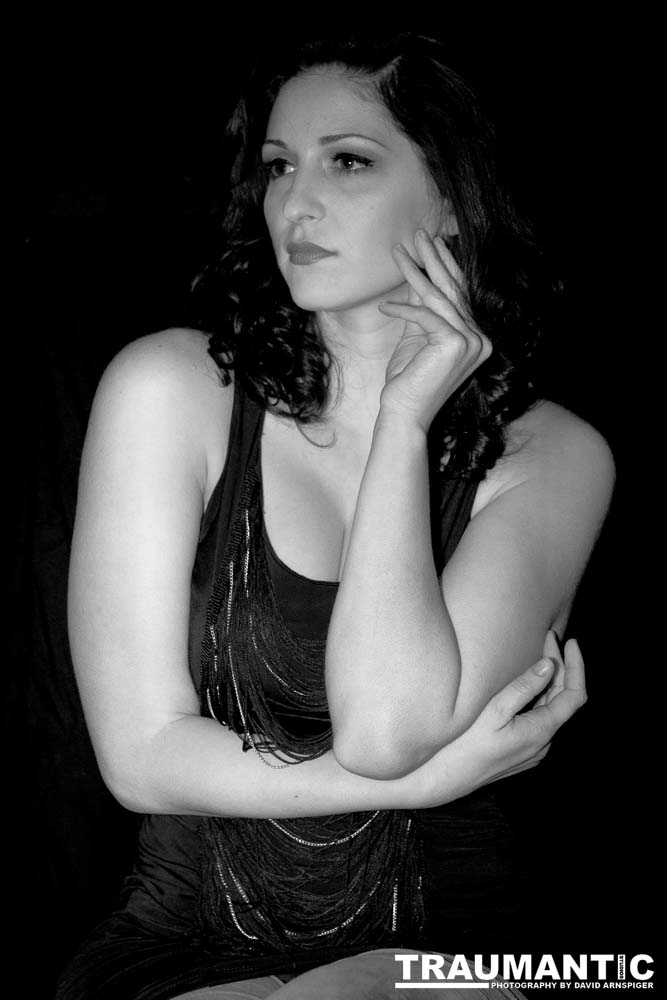 Sometimes you get a chance to shoot with an amazing nude model, and what do you do?  Shoot pictures of her sitting on a chair fully clothed.  She's gorgeous, and I love these shots.