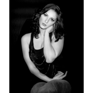 Sometimes you get a chance to shoot with an amazing nude model, and what do you do?  Shoot pictures of her sitting on a chair fully clothed.  She's gorgeous, and I love these shots.