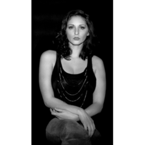 Sometimes you get a chance to shoot with an amazing nude model, and what do you do?  Shoot pictures of her sitting on a chair fully clothed.  She's gorgeous, and I love these shots.