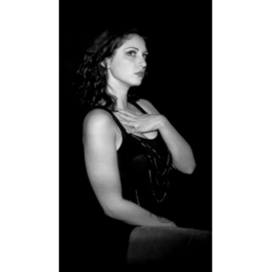 Sometimes you get a chance to shoot with an amazing nude model, and what do you do?  Shoot pictures of her sitting on a chair fully clothed.  She's gorgeous, and I love these shots.