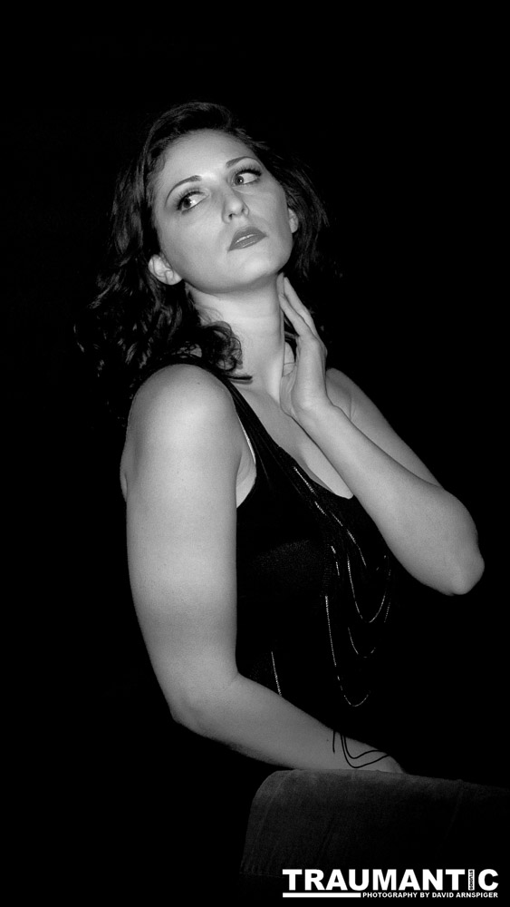 Sometimes you get a chance to shoot with an amazing nude model, and what do you do?  Shoot pictures of her sitting on a chair fully clothed.  She's gorgeous, and I love these shots.