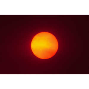 The sun through clouds of smoke.