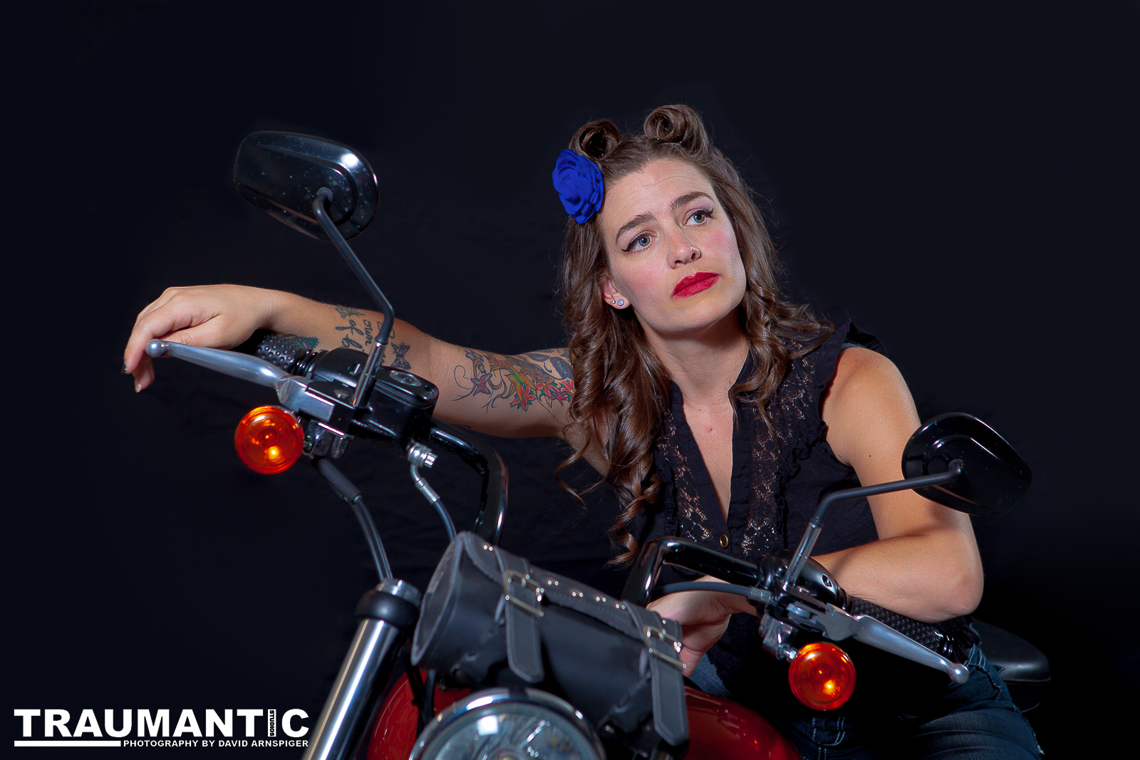 A friend of Emily Emerald who wanted to give a photoshoot a try.  She wanted her motorcycle in the shots and a pinup theme.  We used my garage for a set and got some cool shots.